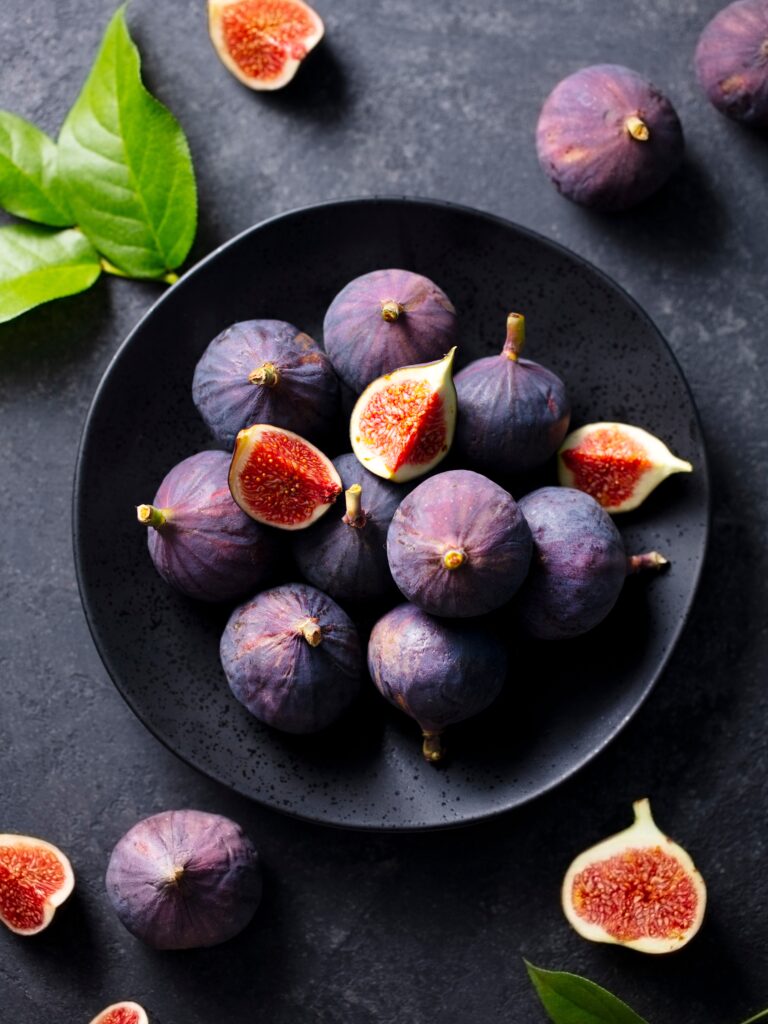 Fresh figs on a dark plate